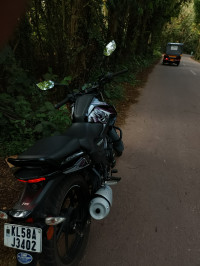 Black TVS Raider 125 Marvel Super Squad Edition