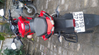 Red Bajaj Pulsar AS 150