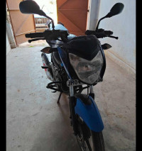 Blue/black Bajaj Pulsar 135LS