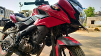 Red Bajaj Pulsar AS 150