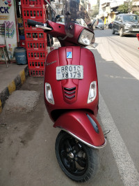 Maroon Vespa SXL 150