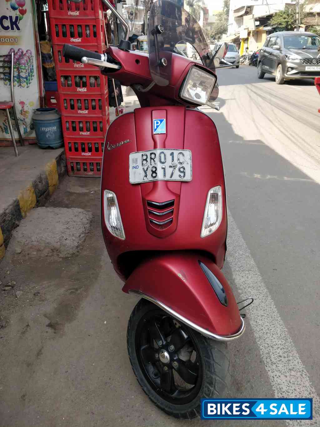 Maroon Vespa SXL 150