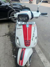 White And Red Vespa SXL 125