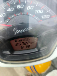 White And Red Vespa SXL 125