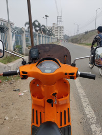 Orange Vespa SXL 125 BS6