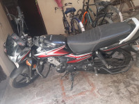 Black/red Honda Shine 100