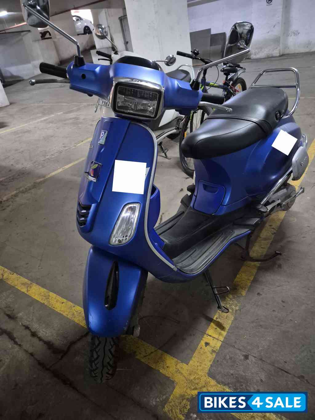 Blue Vespa SXL 125
