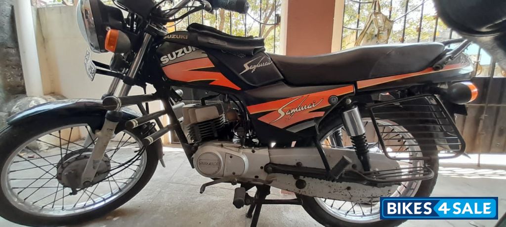 Orange Black Suzuki Samurai