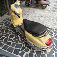 Yellow Vespa VX 125