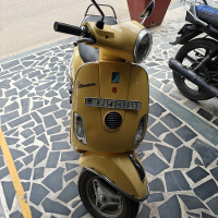 Yellow Vespa VX 125
