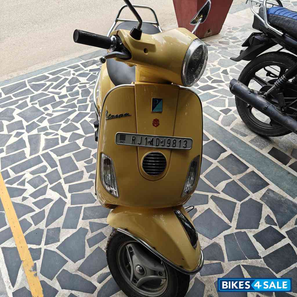 Yellow Vespa VX 125