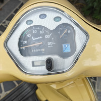 Yellow Vespa VX 125