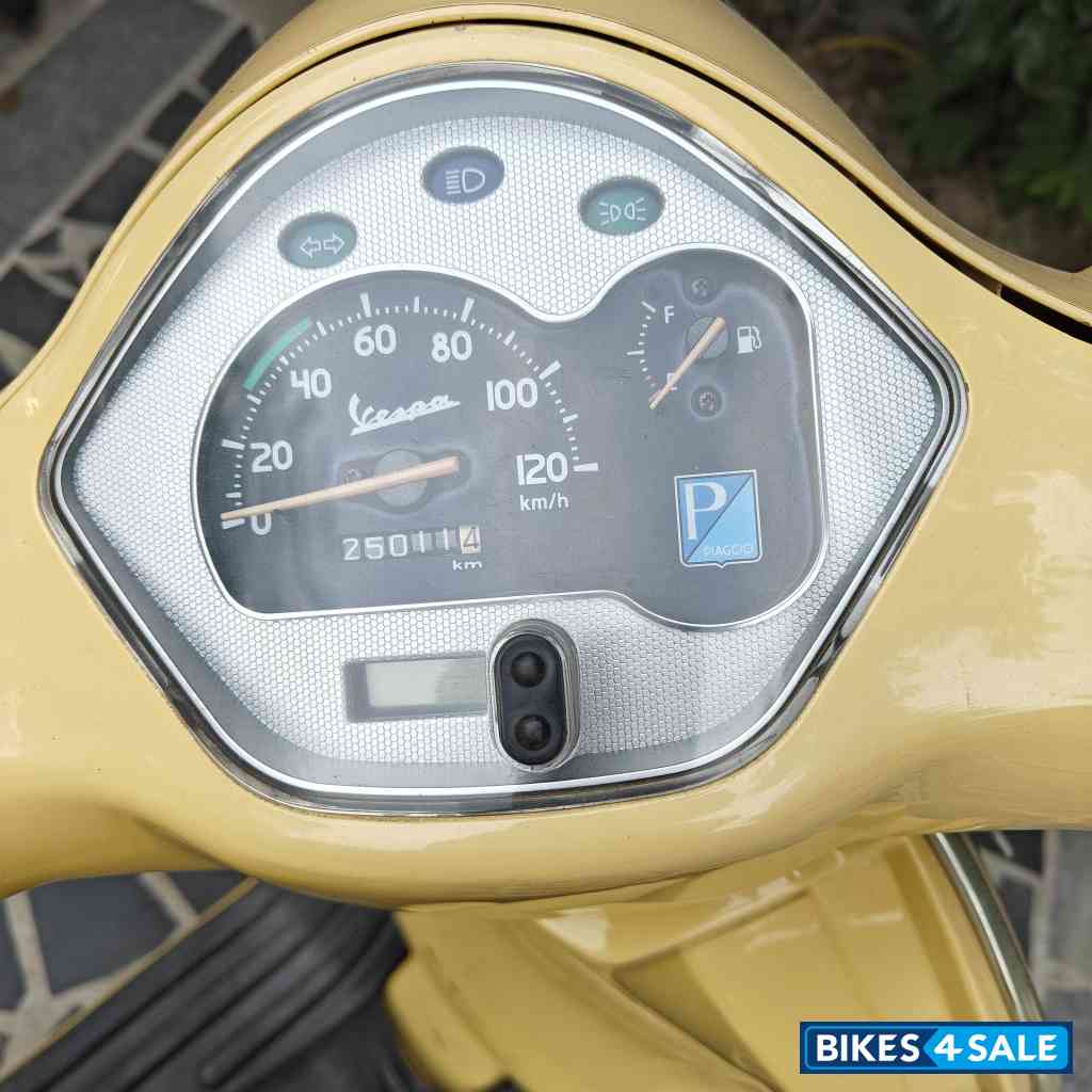 Yellow Vespa VX 125