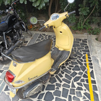 Yellow Vespa VX 125