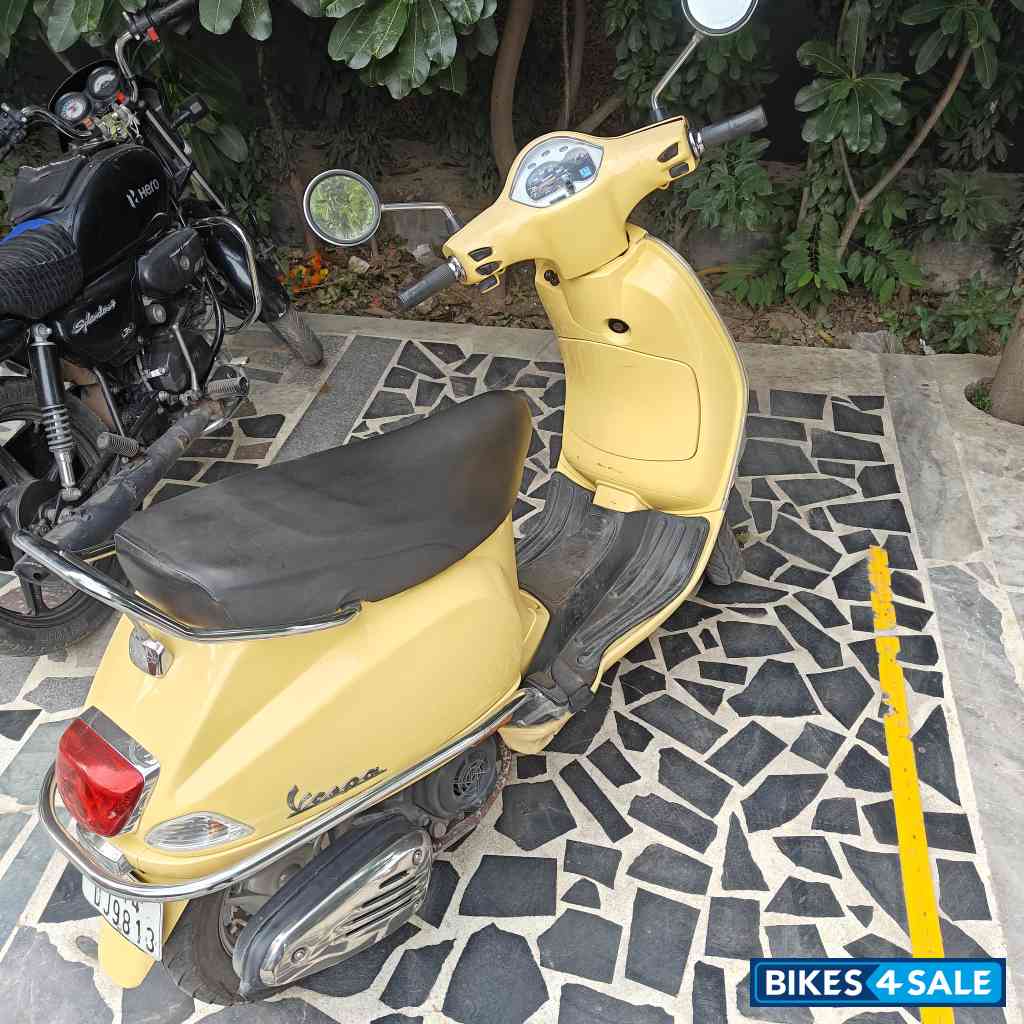 Yellow Vespa VX 125