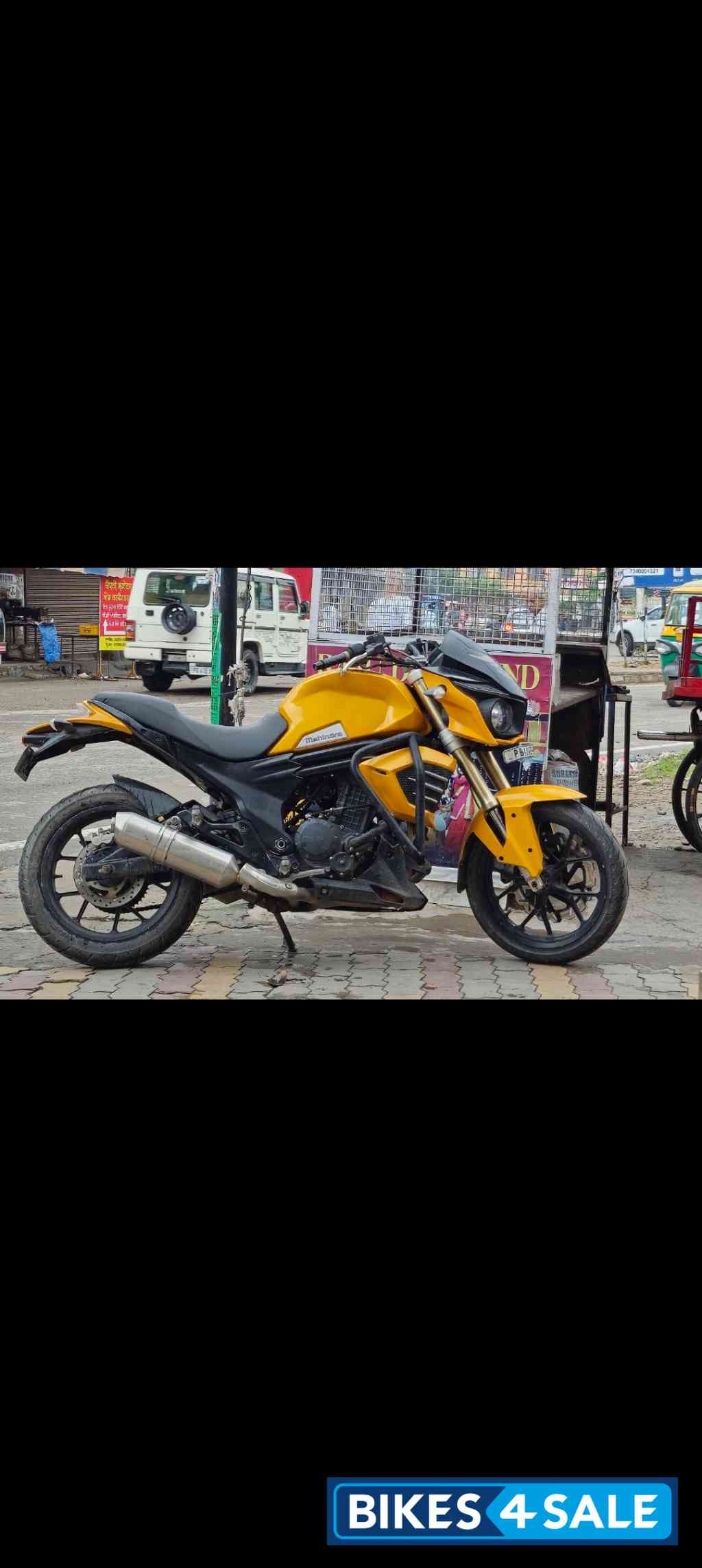 Golden Yellow Mahindra Mojo UT 300