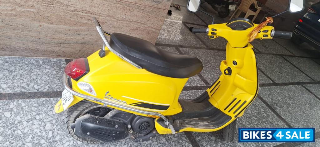 Yellow Vespa SXL 125