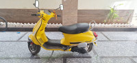 Yellow Vespa SXL 125