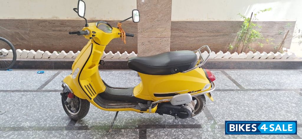 Yellow Vespa SXL 125