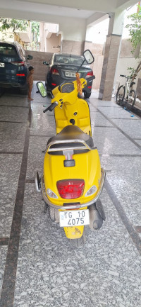 Yellow Vespa SXL 125