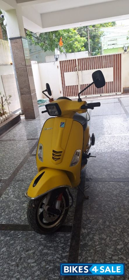 Yellow Vespa SXL 125