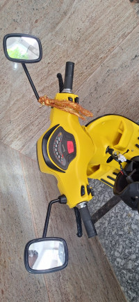 Yellow Vespa SXL 125