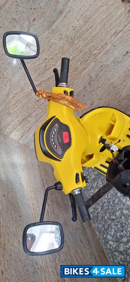 Yellow Vespa SXL 125