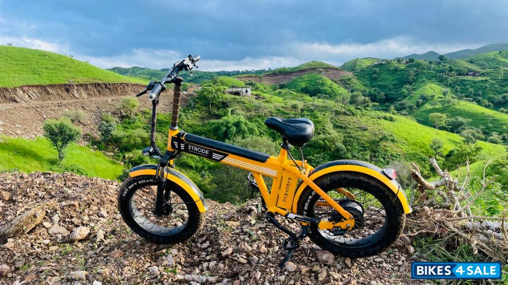 Orange electric cycle Strode pod