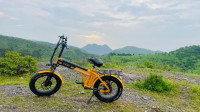 Orange electric cycle Strode pod