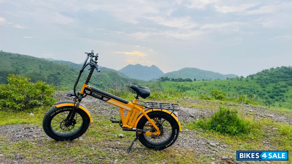 Orange electric cycle Strode pod