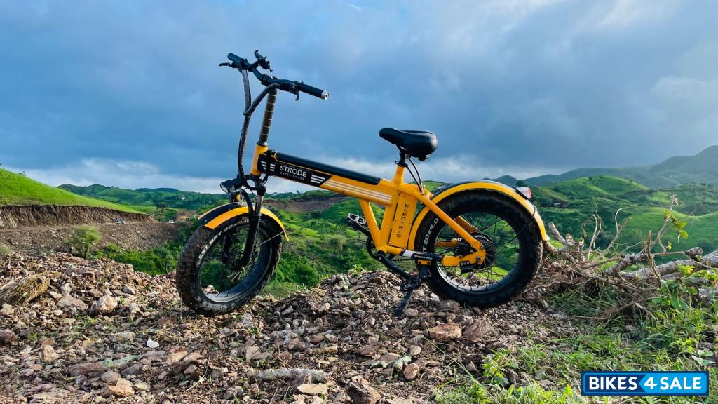 Orange electric cycle Strode pod