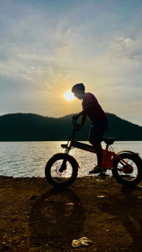 Orange electric cycle Strode pod