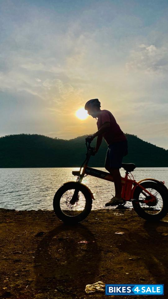 Orange electric cycle Strode pod