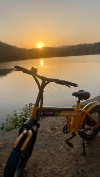 Orange electric cycle Strode pod