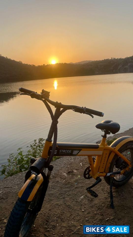 Orange electric cycle Strode pod