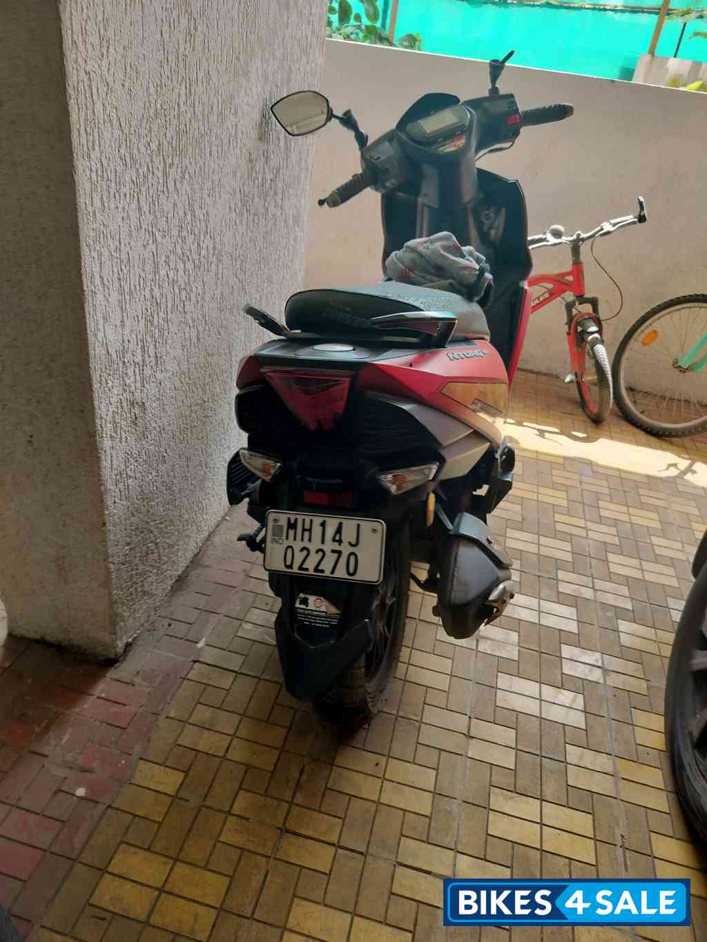 Red TVS NTORQ Super Squad Edition