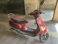 Red Vespa SXL 150 BS6