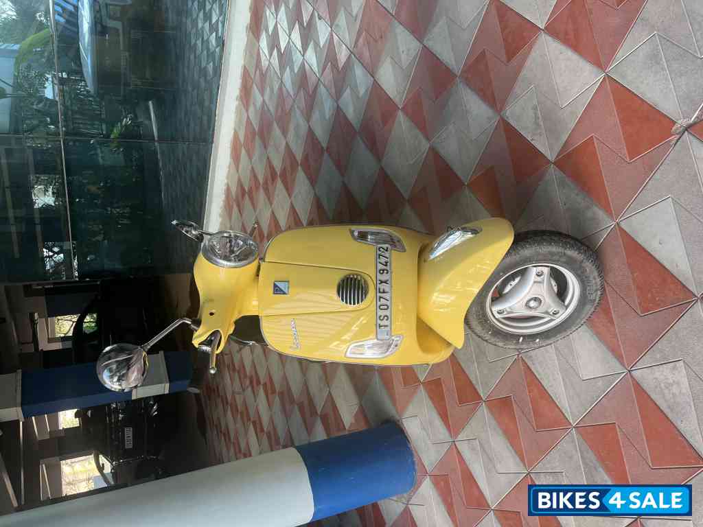 Yellow Vespa LX 125