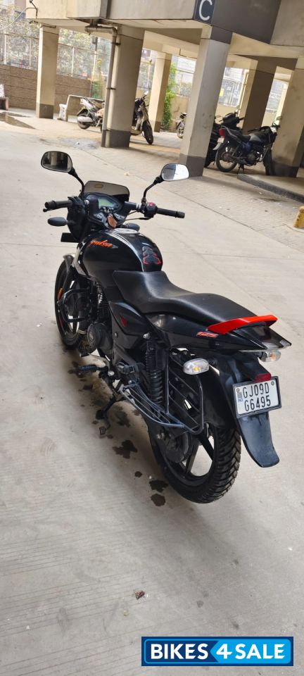 Black-orange Bajaj Pulsar 125