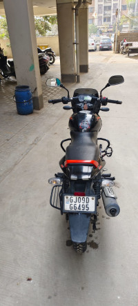 Black-orange Bajaj Pulsar 125
