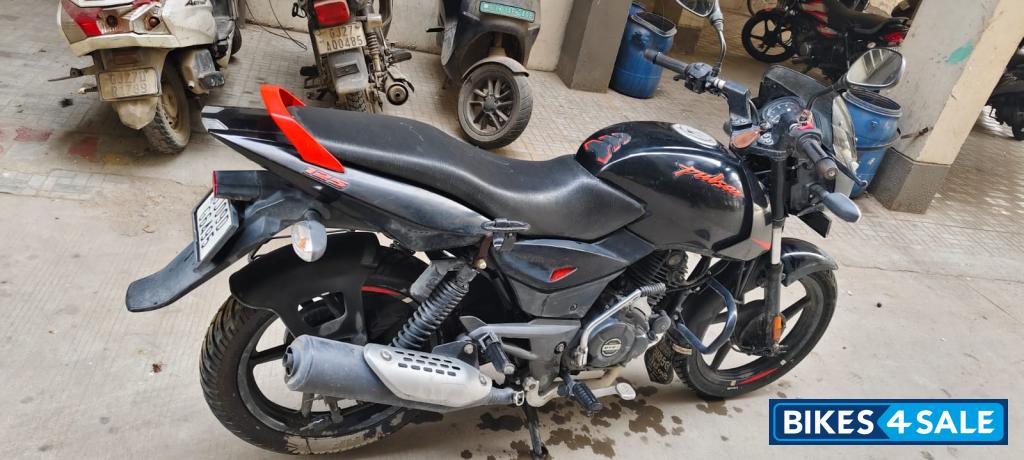 Black-orange Bajaj Pulsar 125