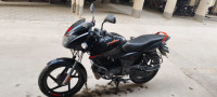 Black-orange Bajaj Pulsar 125