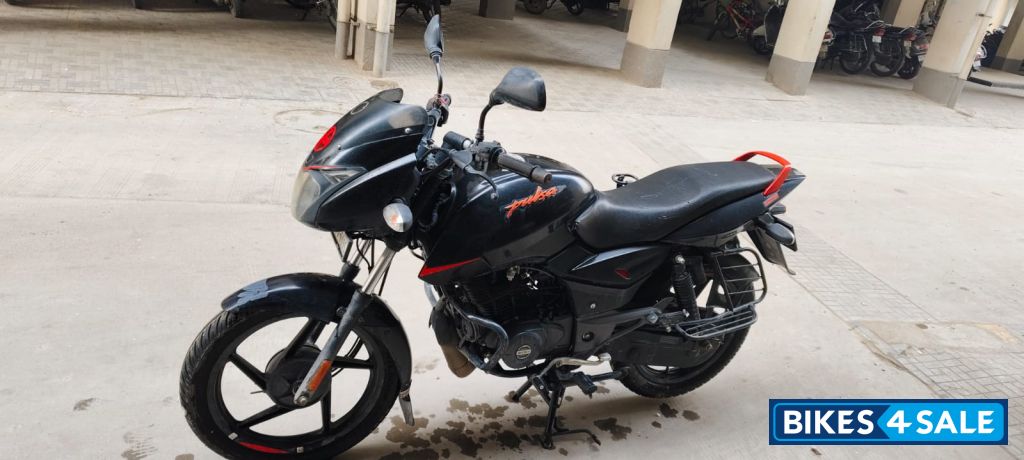 Black-orange Bajaj Pulsar 125