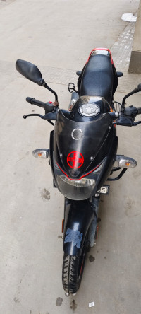 Black-orange Bajaj Pulsar 125