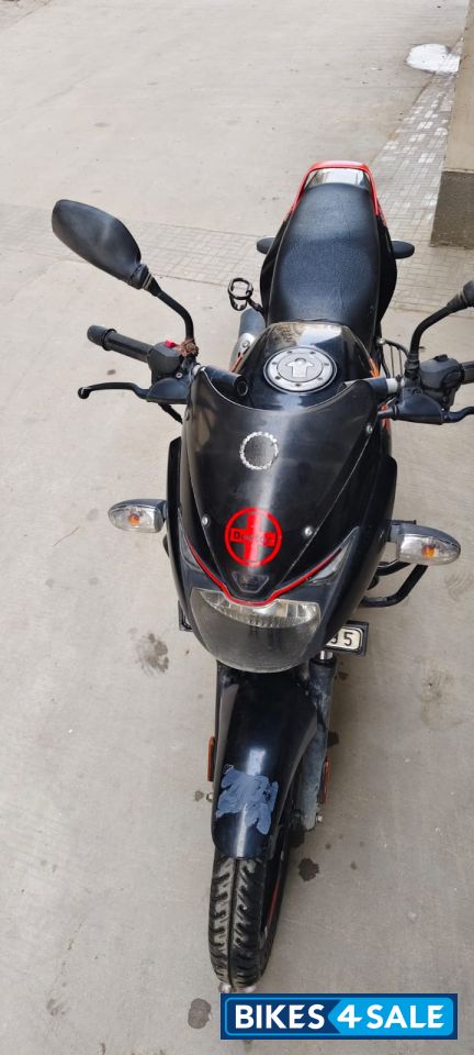Black-orange Bajaj Pulsar 125
