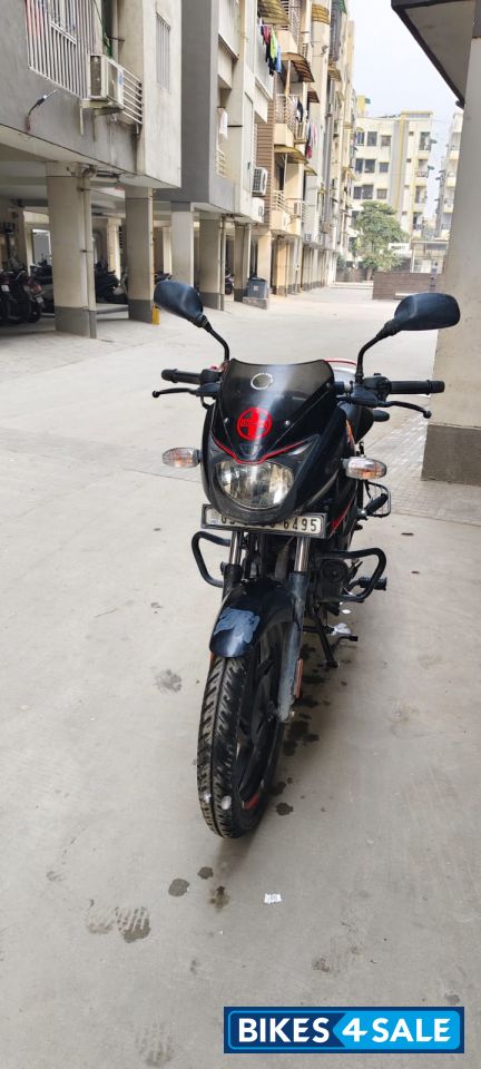 Black-orange Bajaj Pulsar 125