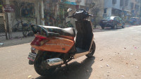 Golden & White Mahindra Gusto 125