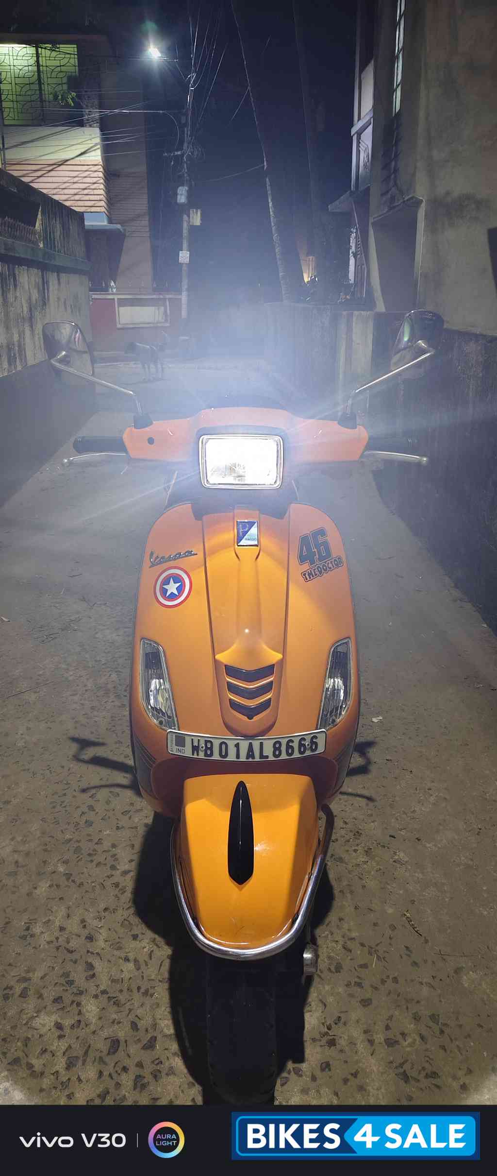 Orange Vespa SXL 150