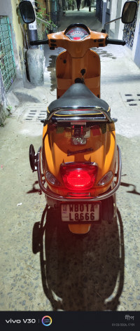 Orange Vespa SXL 150