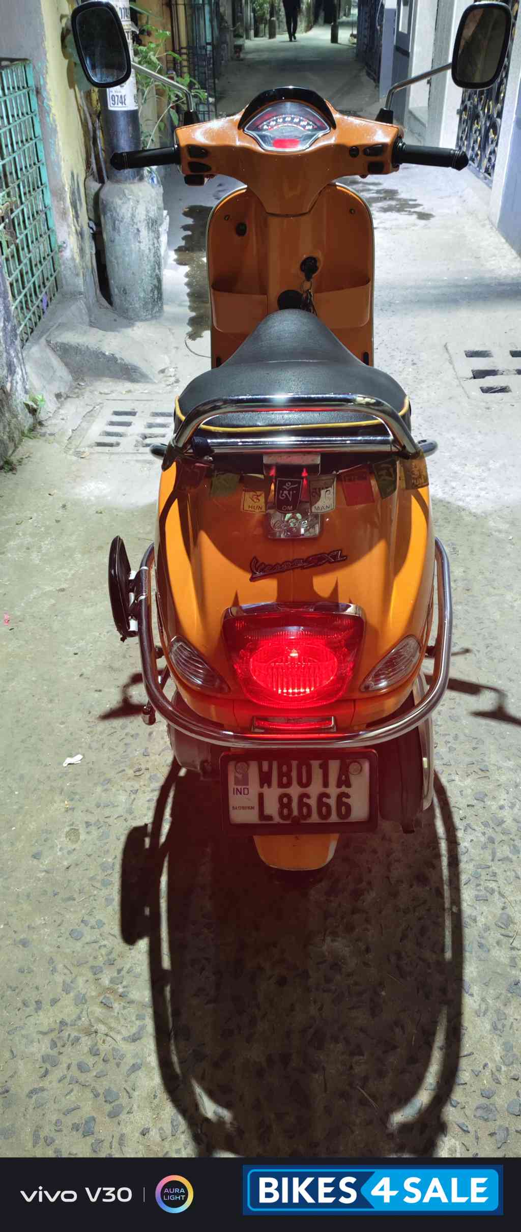 Orange Vespa SXL 150